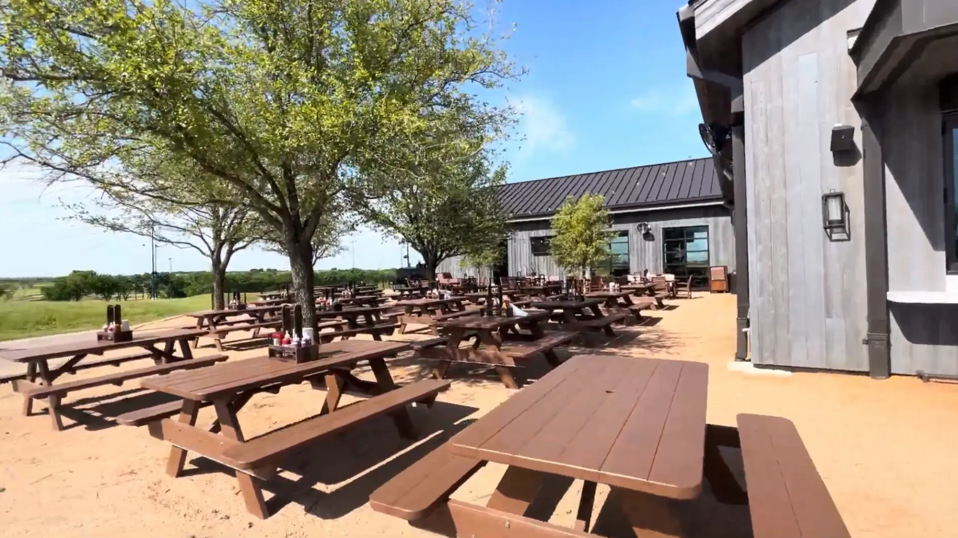 Outdoor dining area at the Ranch House within PGA Frisco