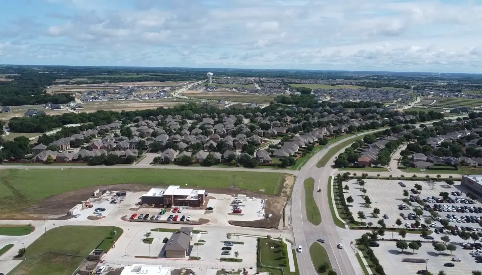 Aerial view of Painted Tree homes, roads and active construction in McKinney Texas