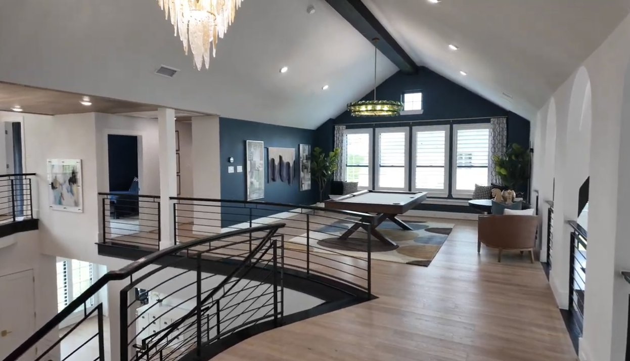 Loft game room interior in a Park Place model home in Prosper, Texas