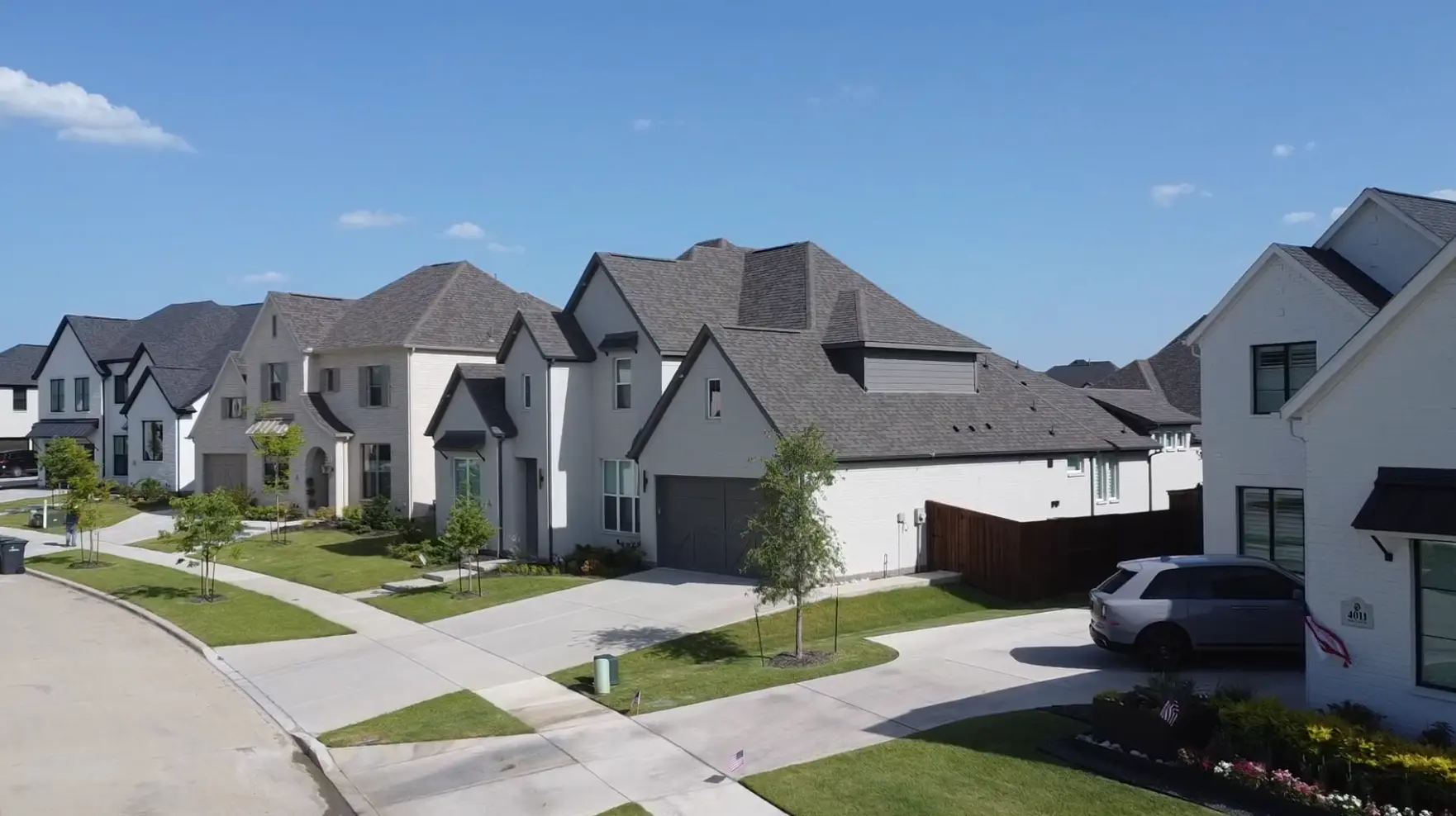 Residential street of new homes in Windsong Ranch Prosper TX