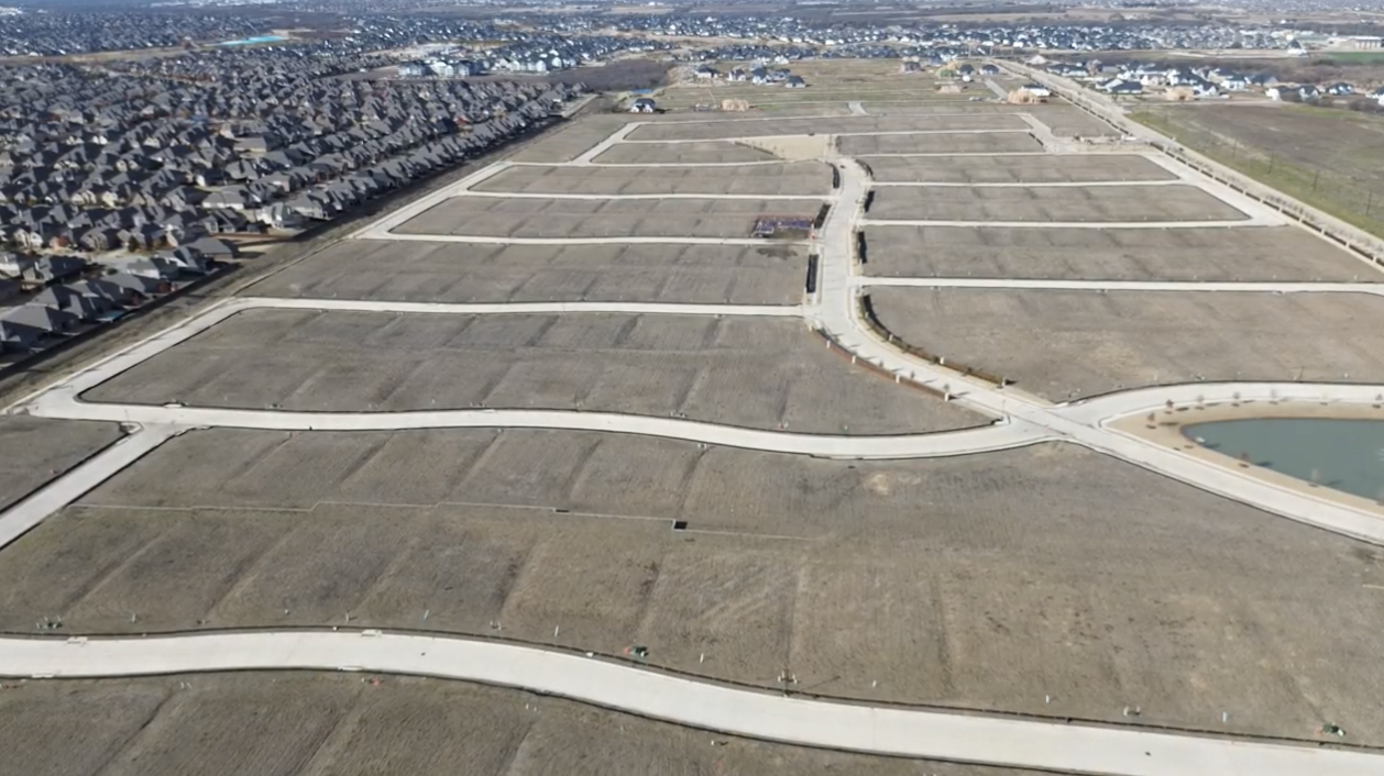 Aerial view of Park Place in Prosper, Texas — oversized homesites staked out along new streets