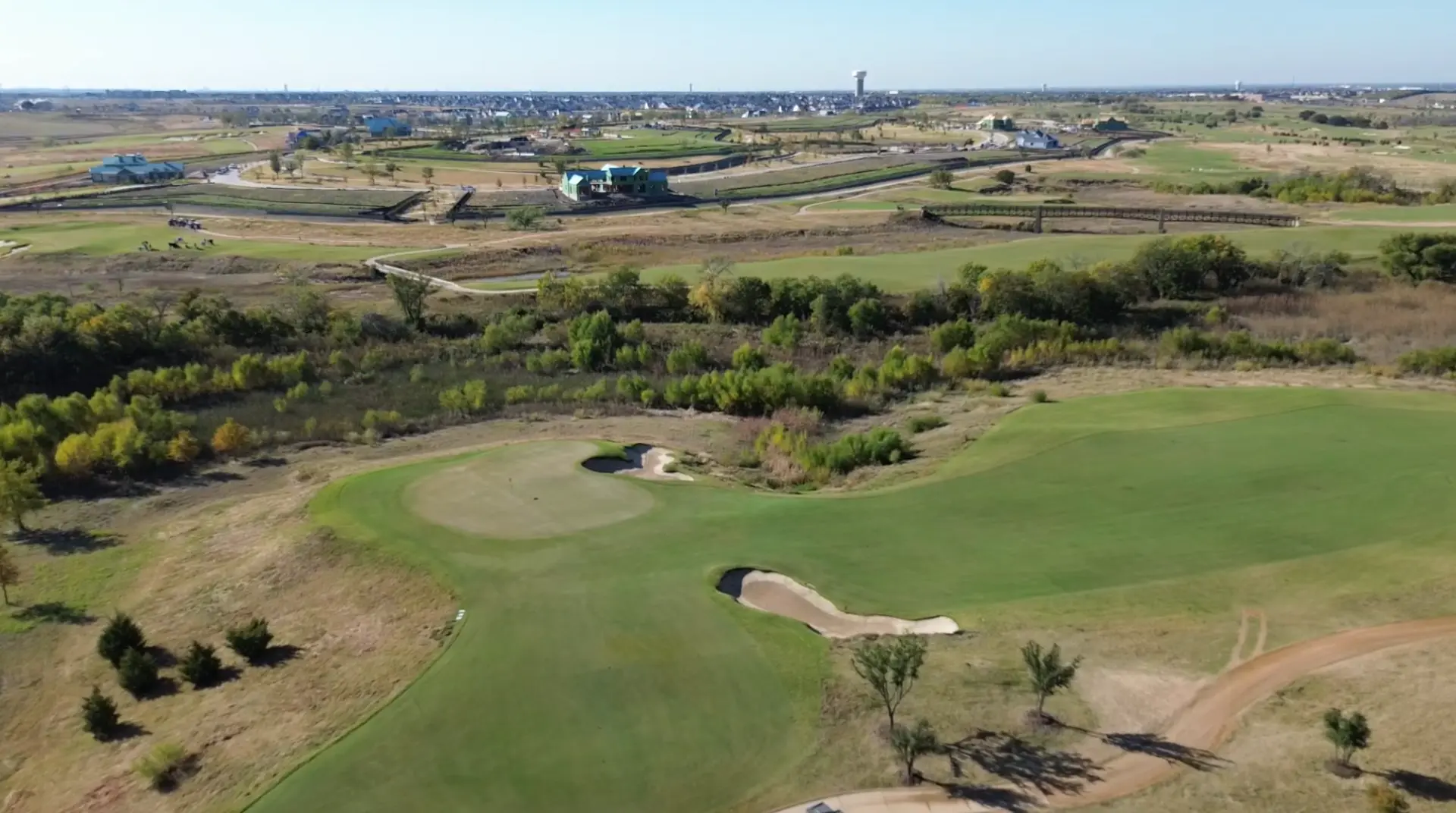 Aerial view across the golf course and open land at PGA Frisco