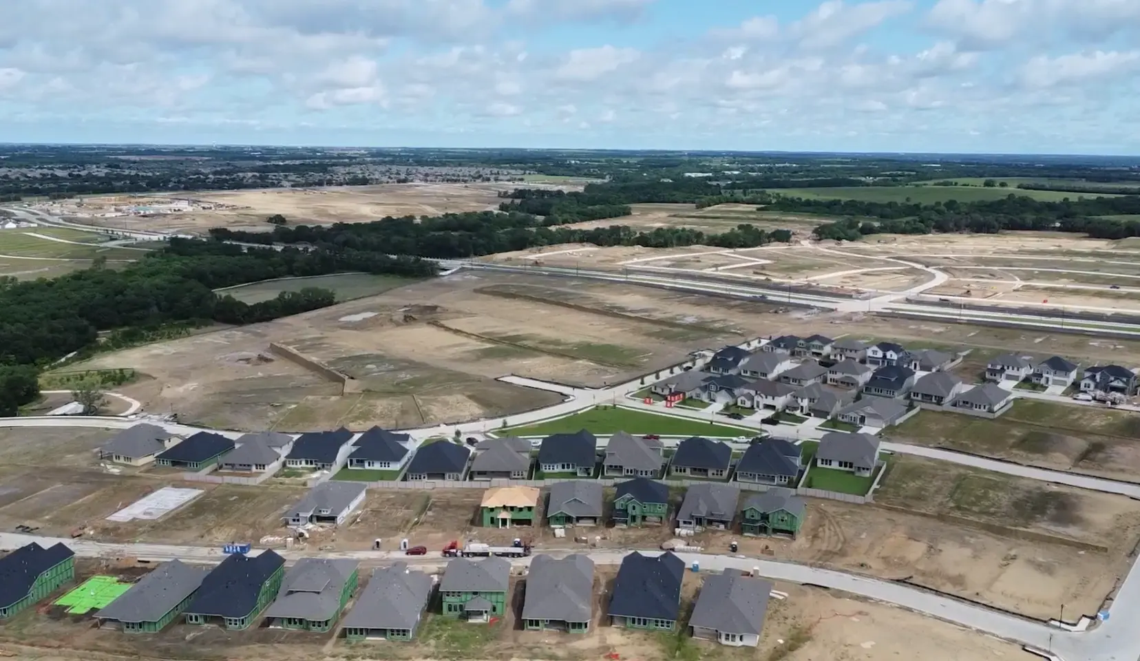 Aerial view of active new-home construction in Painted Tree McKinney TX