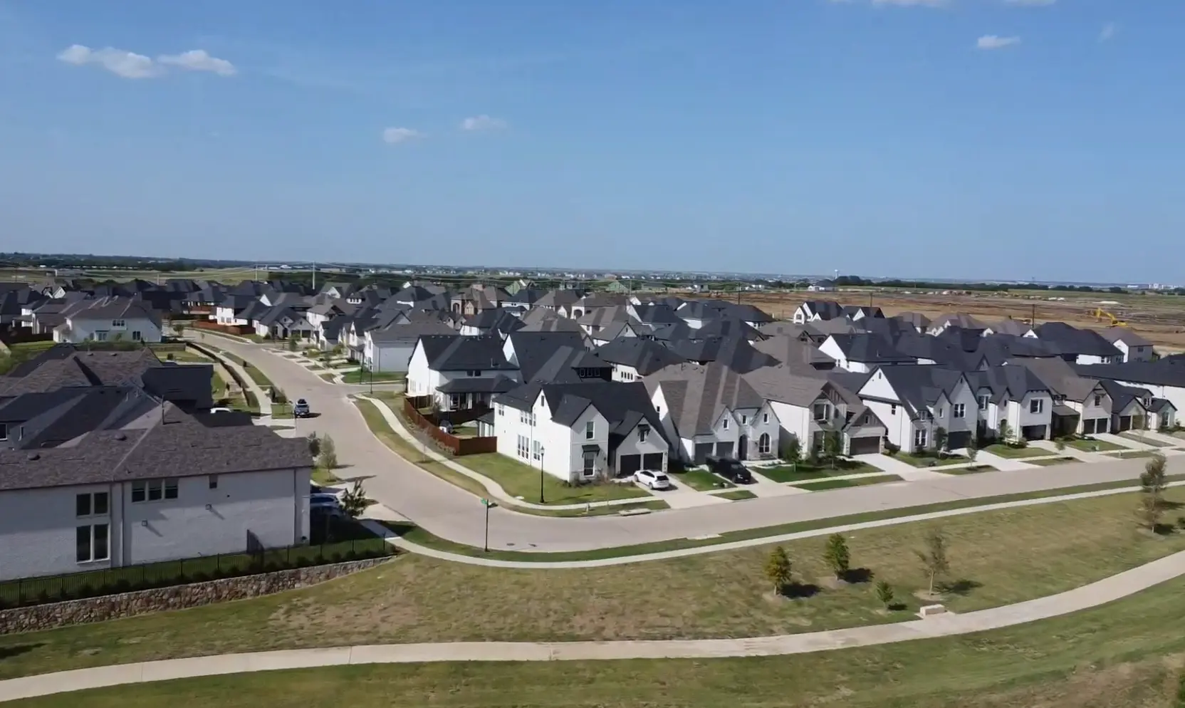 Aerial view of Windsong Ranch neighborhood streets and trails in Prosper