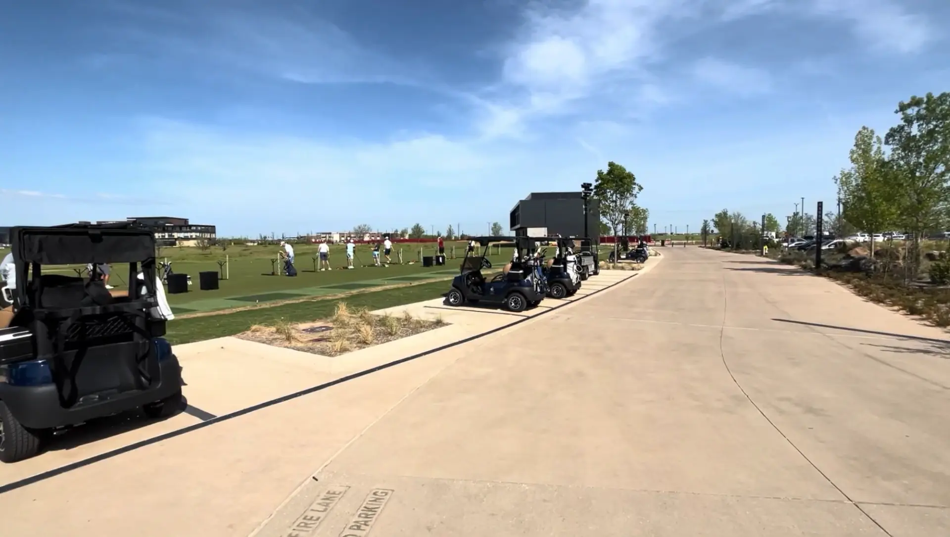 Golf practice range and carts at PGA Frisco